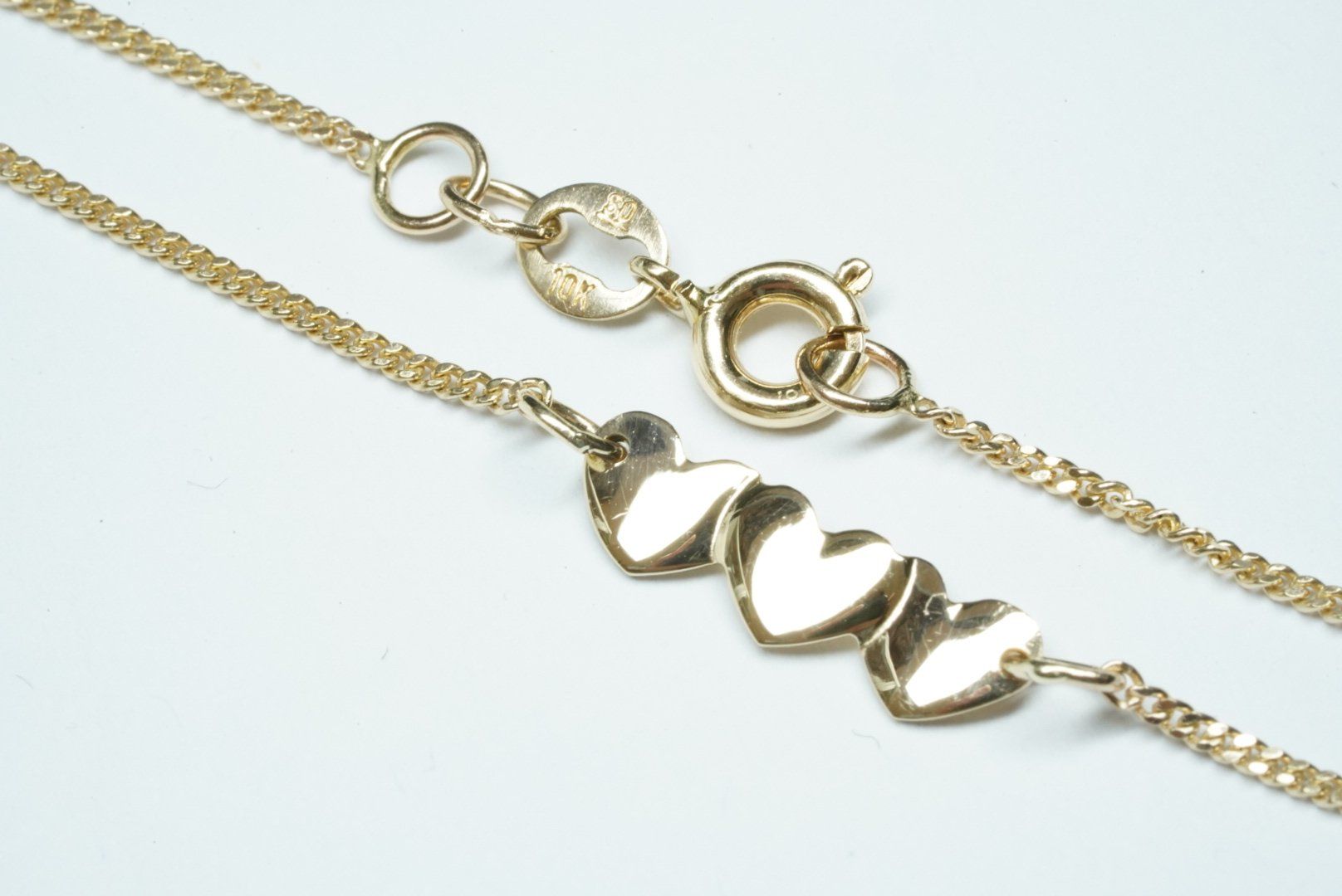 Bracciali & Braccialetti: Kinderarmband Gelbgold 9k mit Herzen – Usato da Bülach venduto da Re-Jewelled 3