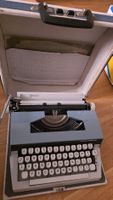 Schreibmaschine Swiss Journease blau mit Koffer