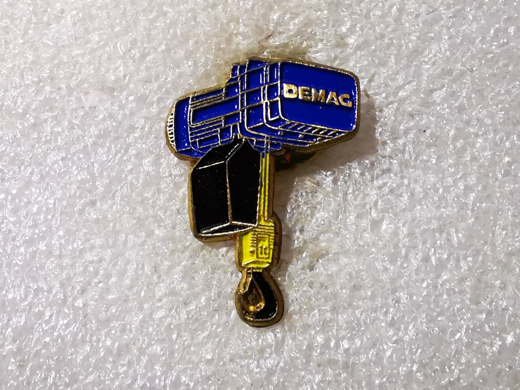 Placchette & Badge: Ansteckpin 56: Demag – Usato da Oppligen venduto da Pin-Fall-Shop