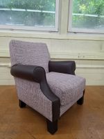 Designer Sessel mit Karomuster und braunen Lederakzenten