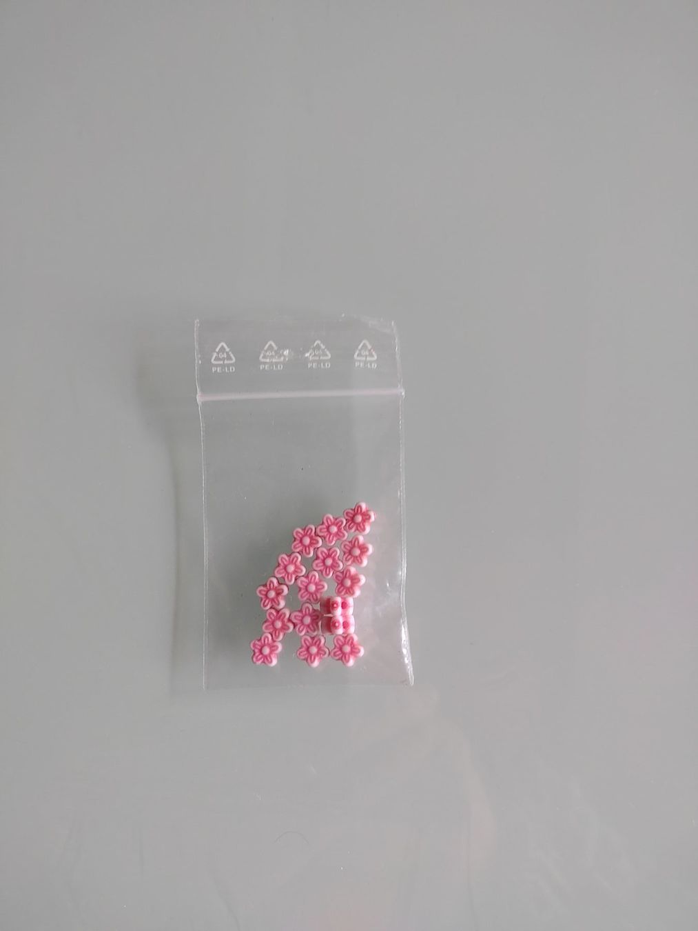 Perle (finte): Bastelperlen Blumen rosa – Usato da Langenthal venduto da Markus-70