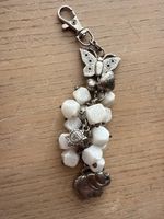 Taschenanhänger, Amulet mit Schmetterling und Elefan