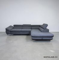 Graues Ecksofa mit Schlaffunktion und Stauraum