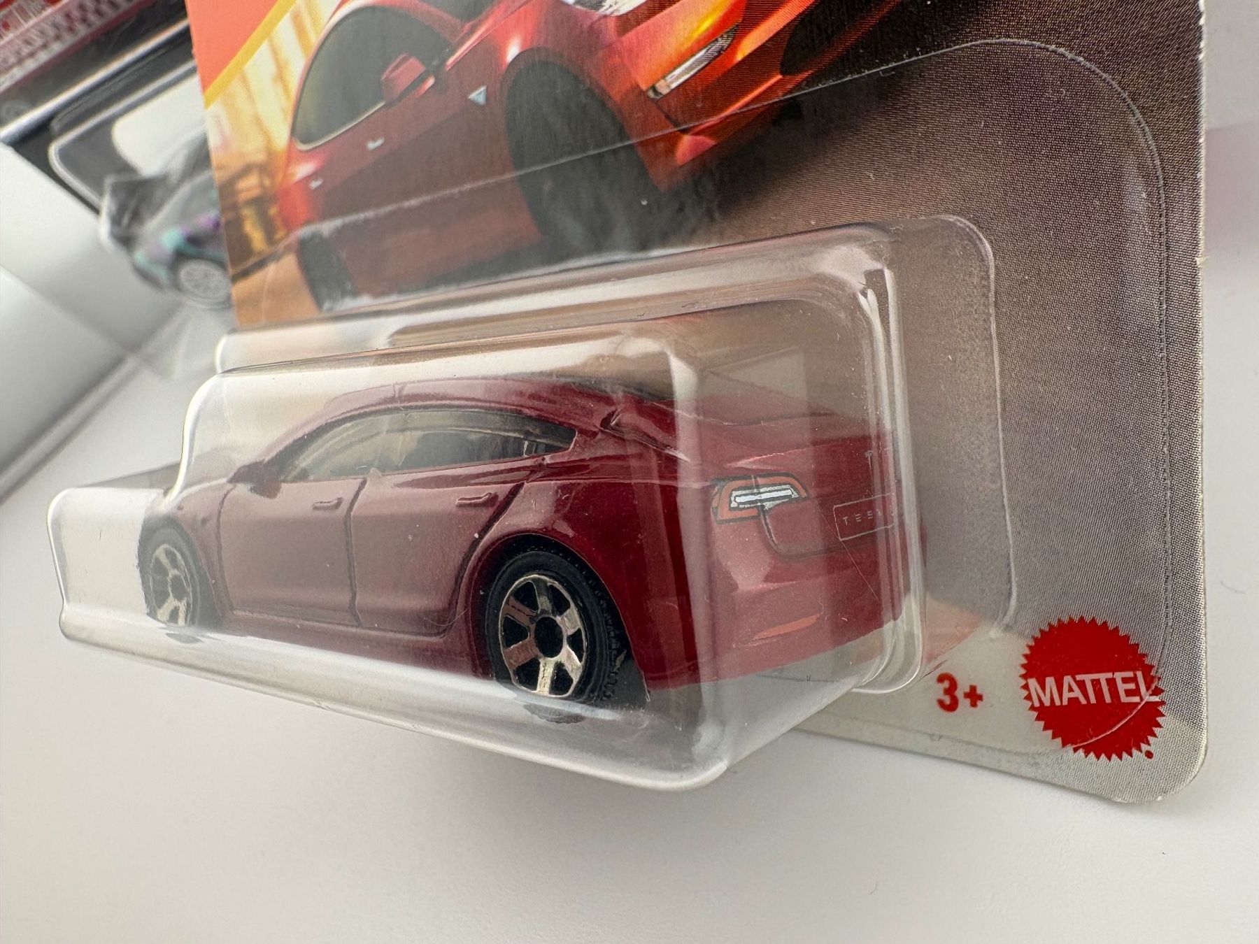 Matchbox Modellini d'auto: Matchbox Tesla Model 3 - 2024 - 4/125 – Nuovo e nell'imballaggio originale da Flawil venduto da HeisseReifen 3