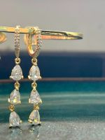 Boucles en acier inoxydable et zircons blancs