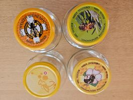 Vier gebrauchte "Honig"gläser