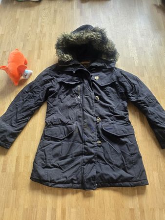 Parka Woolrich noir, taille L, parfait pour l'hiver!
