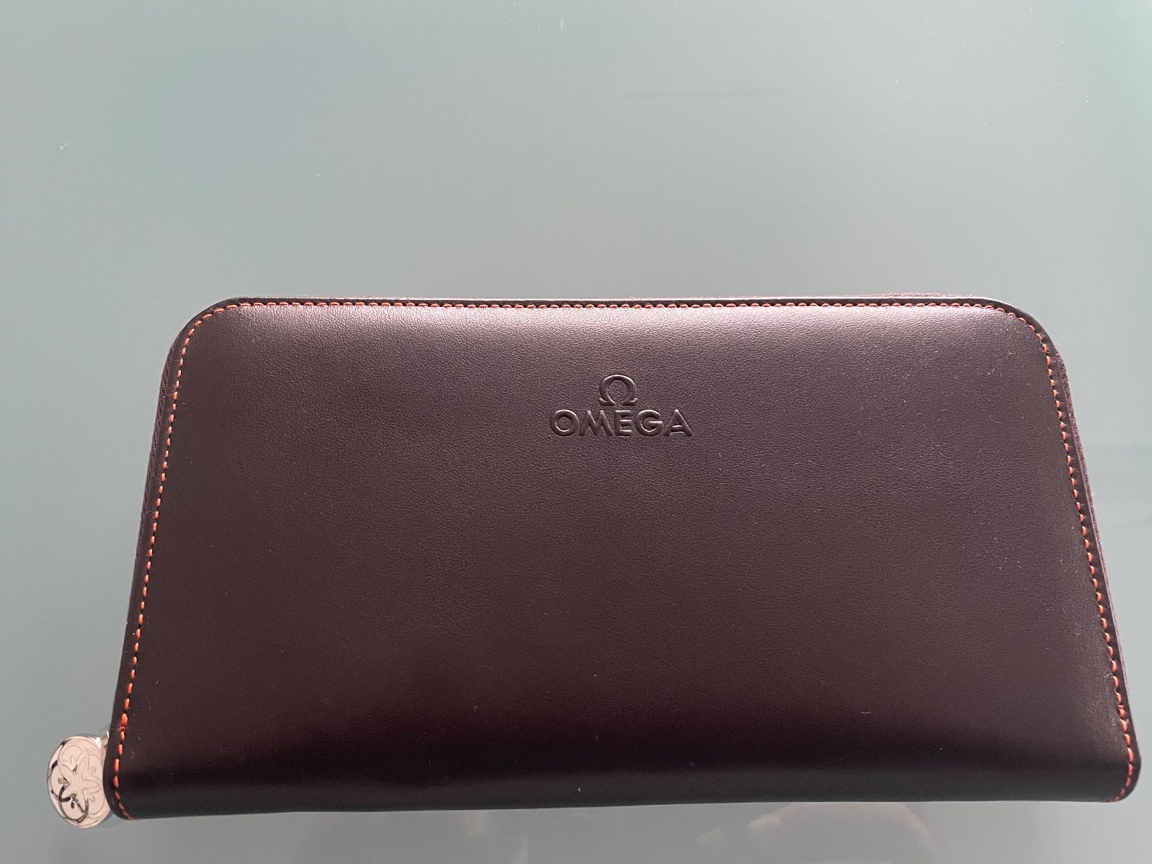 Portamonete: OMEGA Brieftasche, Braun/Orange – Nuovo e nell'imballaggio originale da Zuzwil SG venduto da Skotm 1