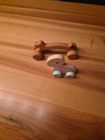 Holzspielzeug: Rollhund und Knochenroller