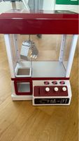 Machine à pince jouet rétro - Amusement garanti!