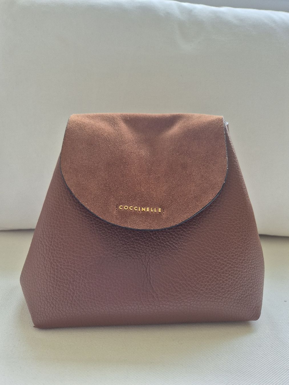 coccinelle brown leather ariel mini backpack Handcrafted the distinctive flap closure with plectrum is the symbol of Coccinelles identity GIANNI CHIARINI Violette contrast-stitch Drawstring
