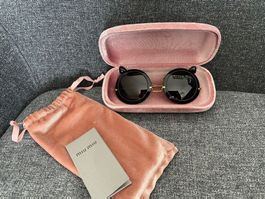 Miu Miu signature sun glasses