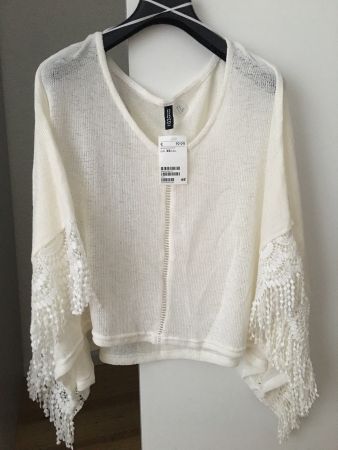 Ungetragener Poncho