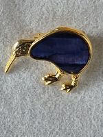 Charming Gold Kiwi Bird Brooch with Blue Inlay.