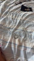 Collier avec pendentif rond et pompon