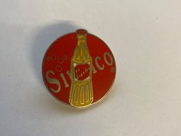 Pin's publicitaire Sinalco rond rouge état