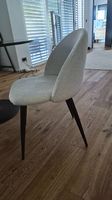 2 fluffy white and Black chairs
