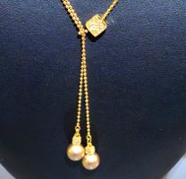 Collier Swarovski doré, incrusté de pierres avec 2 perles