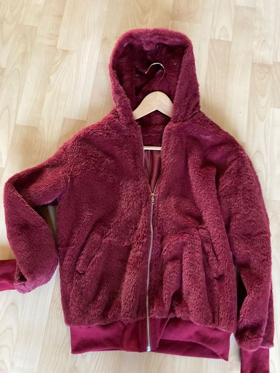 schwarze felljacke mit kapuze