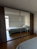 Wardrobe with mirrored doors