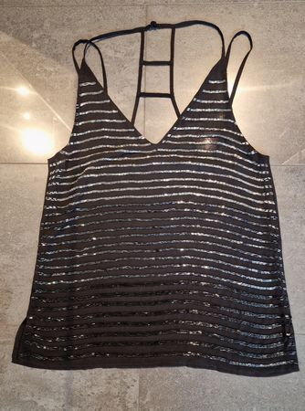 Top nero con dettagli lurex, taglia 36, ideale per serate.