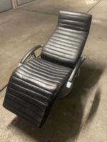 Fauteuil relax en cuir noir pivotant état d'occasion