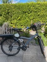 E-Bike B'TWIN Damen vollgefedert mit Korb und Gepäckträge...
