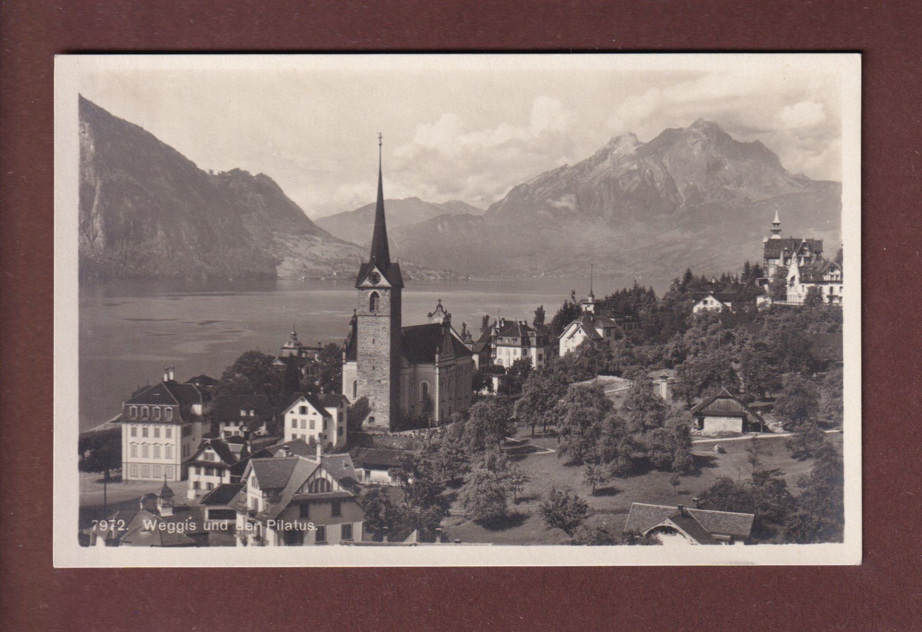 Cartoline postali: WEGGIS - Teilansicht - Kirche - Pilatus – Usato da Pully venduto da nicecards-shop