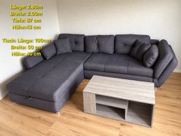 Ecksofa mit Bettkasten und Couchtisch in Grau gebraucht