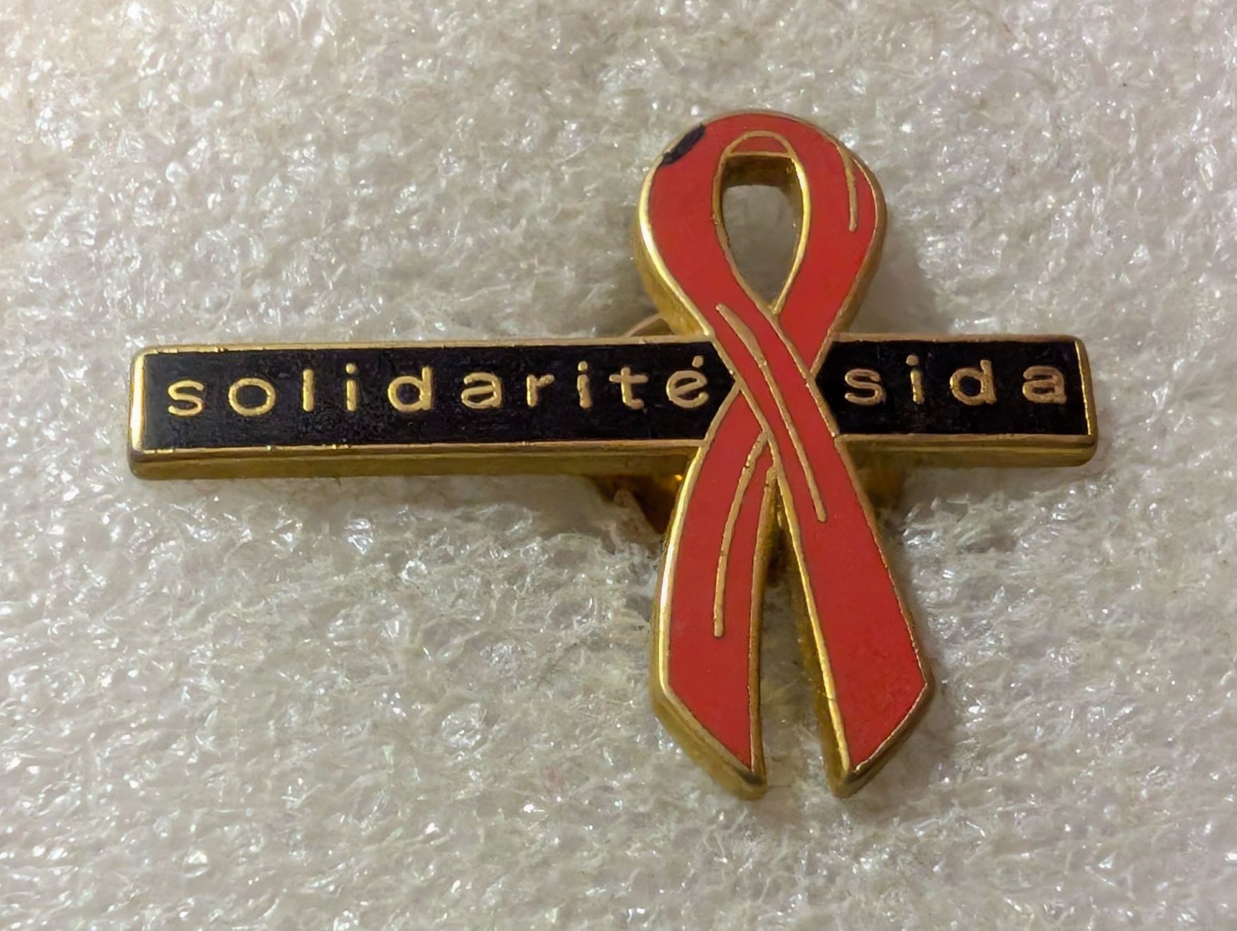 Placchette & Badge: Ansteckpin 180: Solidarite Sida – Usato da Oppligen venduto da Pin-Fall-Shop