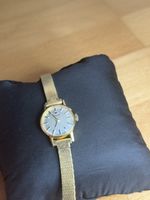 Montre Tissot dorée mécanique 