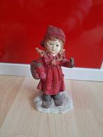 Deko Figur Mädchen mit Skiern rot 
