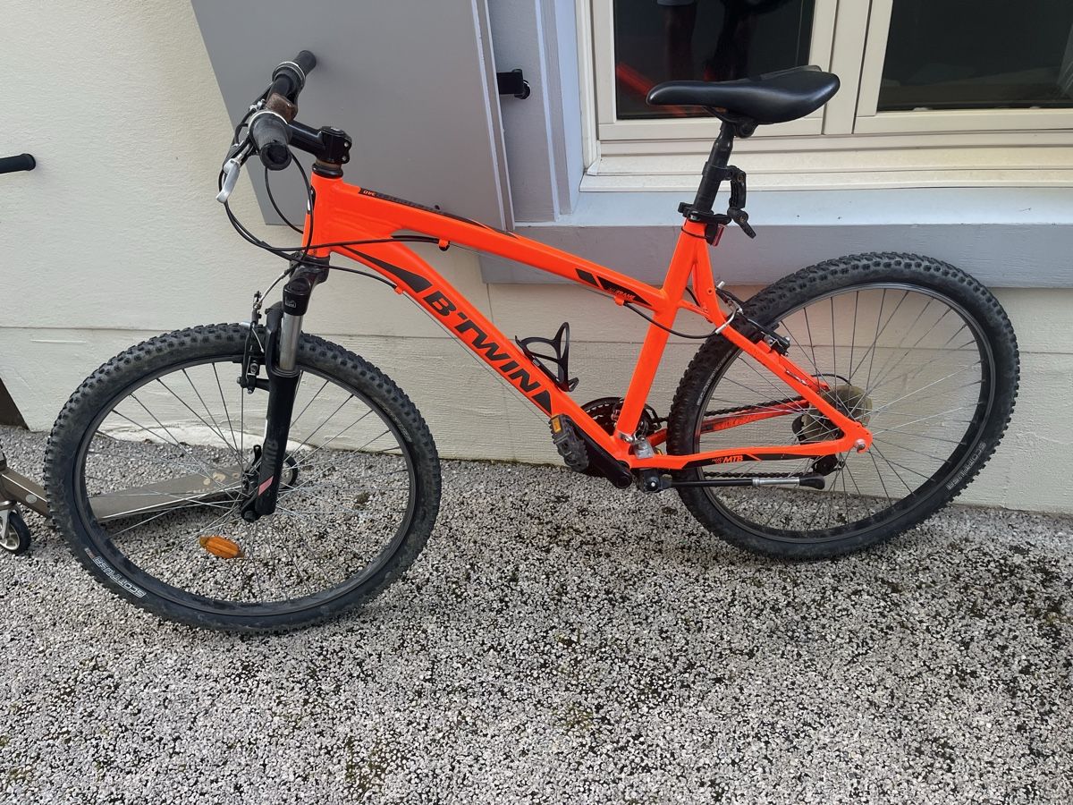 Biciclette: B'Twin Rockrider orange MTB Velo – Difettoso da Muttenz venduto da emun 1