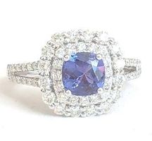 Juwelenring mit 1 Tansanit 0.90 ct. und 64 Diamanten, 3850.-