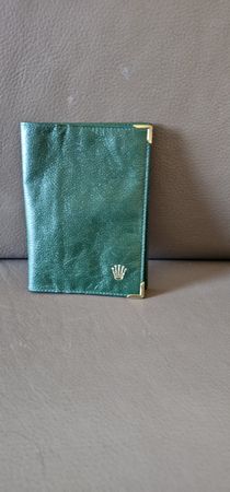 PORTEFEUILLE EN CUIR VERT OLIVE   ROLEX  TRACE D'USAGE