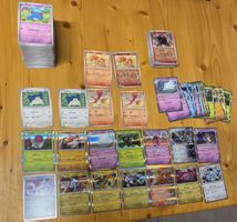 330 Karten aus Surging Sparks Englisch Pokemon