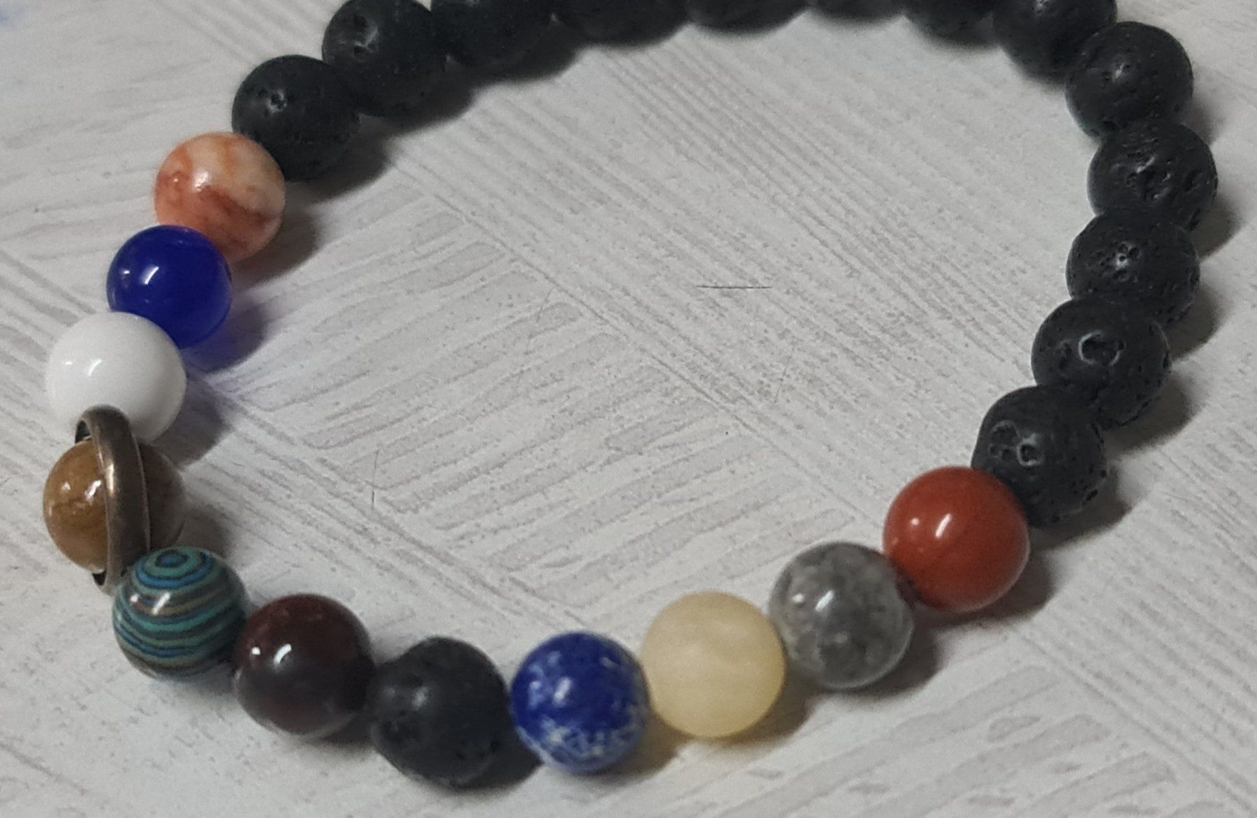Bracciali & Braccialetti: Solar System Planeten Armband aus Stein – Nuovo e nell'imballaggio originale da Uerkheim venduto da Kaufoption 5