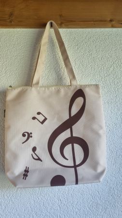Schultertasche mit Notenmotiv, neuwertige Stofftasche