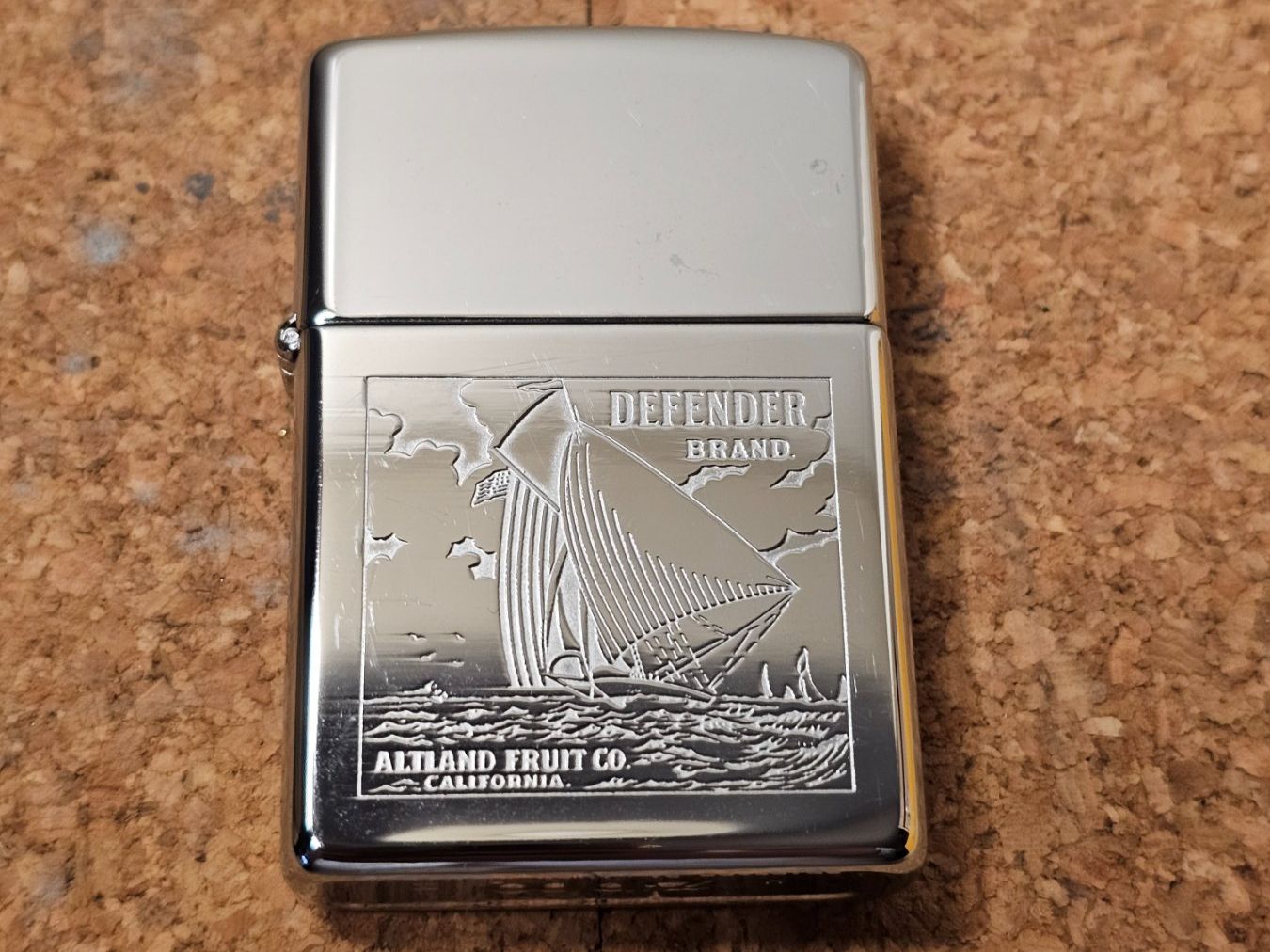 Zippo Accendini: Zippo Defender Brand Altland Fruit Co. – Usato da Genève venduto da Djoff