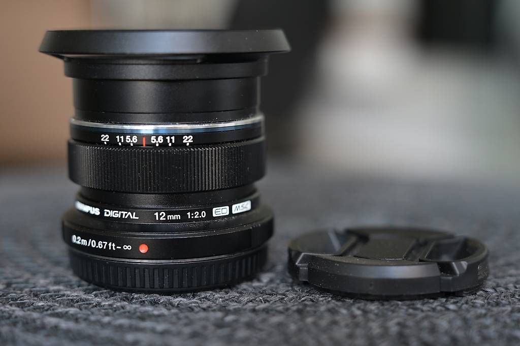 Olympus Obiettivi: Olympus / OM System 12mm f2 Objektiv – Usato da Dübendorf venduto da seadart