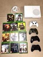 Xbox One S with games and controllers