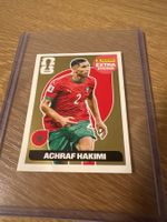 Extra Sticker Gold WM 26: Achraf Hakimi