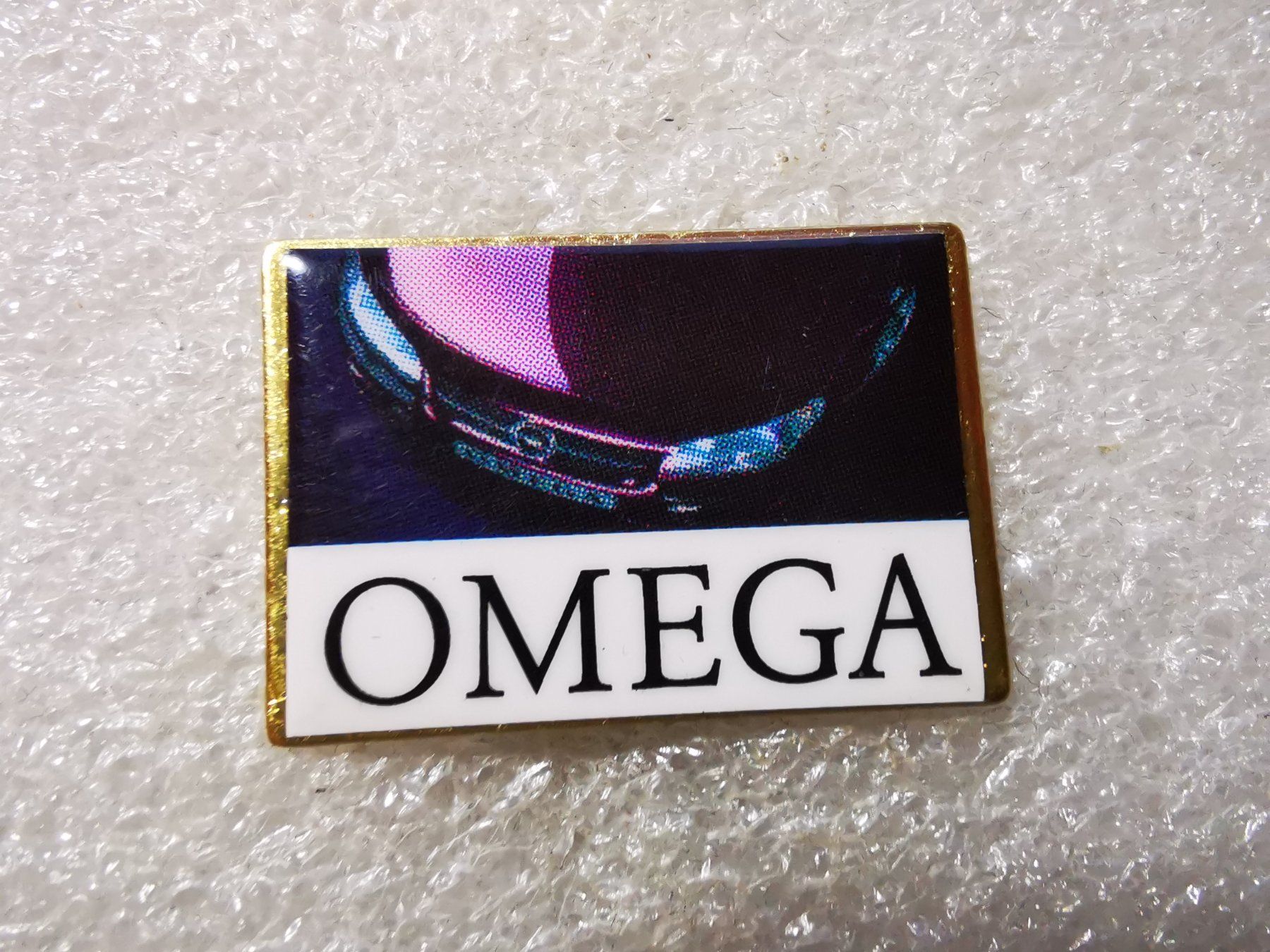 Placchette & Badge: Ansteckpin 192: Omega – Usato da Oppligen venduto da Pin-Fall-Shop