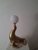 Deko-Lampe Seelöwe mattgold / Lampe otarie or mat