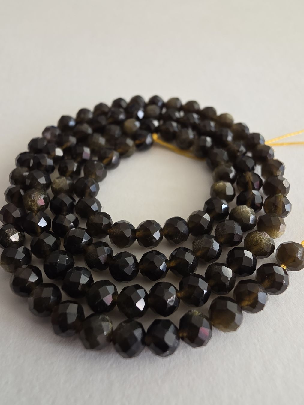 Minerali & Pietre curative: Obsidian facettiert 4mm. Strang – Nuovo e nell'imballaggio originale da Menziken venduto da Mirager