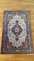 Tapis persan Ispahan bleu, env. 100 × 150 cm, soie / nouage