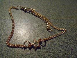 Armband goldfarbig Stern, weisser Stein