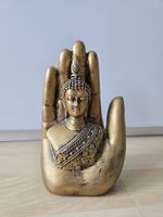 Hand mit Buddha
