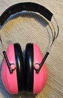 Casque anti-bruit rose pour enfant, bon état