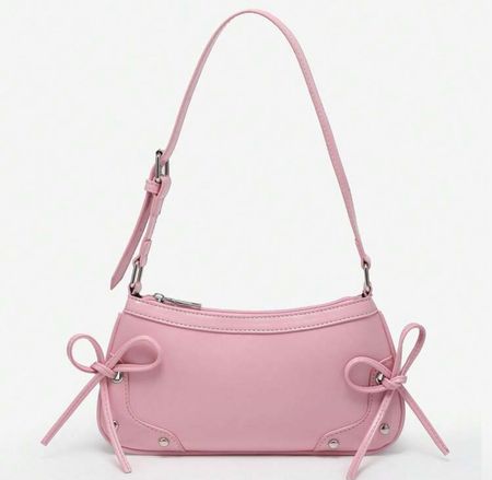 Sac à main rose avec des nœuds décoratifs, parfait été